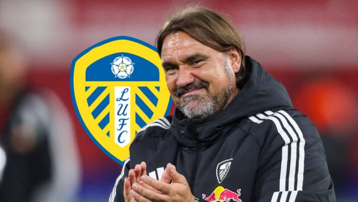 A smiling Leeds United manager Daniel Farke next to the club badge
