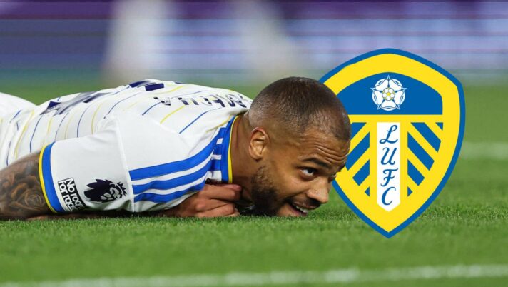Leeds striker Lukas Nmecha next to the club badge