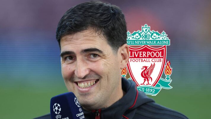 Liverpool manager Andoni Iraola next to the club badge