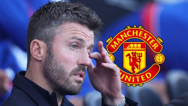 Manchester United manager Michael Carrick next to the club badge