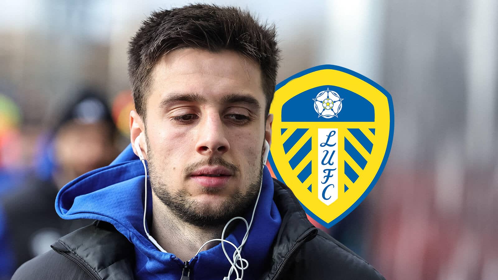 Leeds United star Ilia Gruev next to the club badge