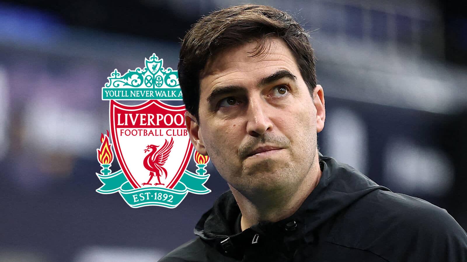 Liverpool boss Andoni Iraola next to the club's badge